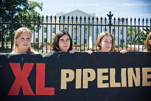 Protesters stand in front of the Whitehouse protesting the Keystone XL pipeline.
