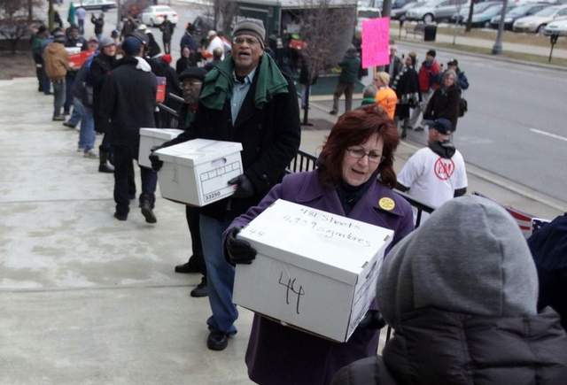 Over 200,000 signatures were delivered to repeal Public Act 4 (Source: Detroit Free Press)