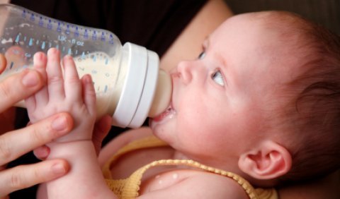 Bottle-feeding a baby