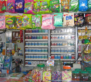 Cigarette retail 'power wall' surrounded by candy