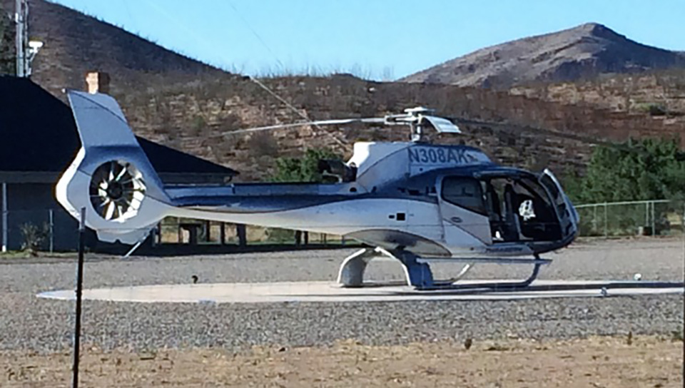 Helicopter owned by Howard Buffett parked on helipad in front of Christiansen compound, June 2016. (Photographer asked to remain anonymous)