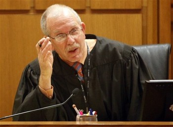 Judge John C. Albert presides over a hearing at the Dane County Courthouse (Photo courtesy of AP)