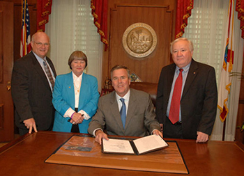 NRA lobbyist Marion Hammer with Governor Bush at Stand Your Ground bill signing, April 2005