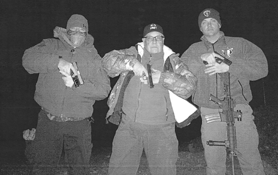 Howard Buffett (center) and friends posing for an IPhone photo near the Mexican border. (Courtesy of Decatur Police Department)