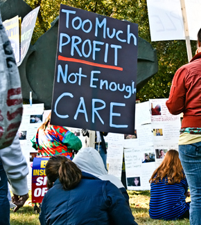 Too Much Profit, Not Enough Care sign