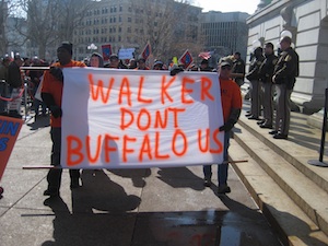 The private-sector Laborers Union marched in with a buffalo head and an eloquent sign