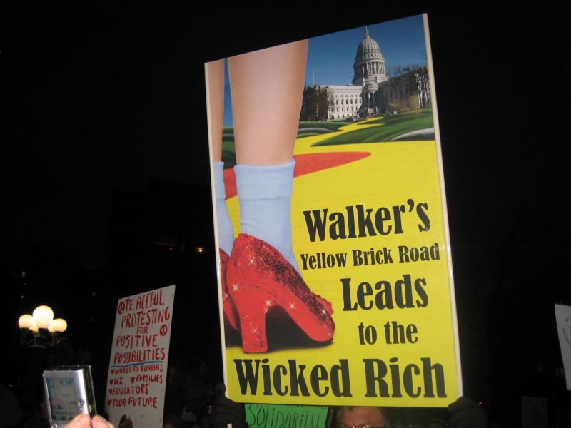 Walker's Yellow Brick Road Leads to the Wicked Rich protest sign