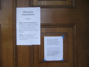 A copy of the Wisconsin Constitution's provisions on open government was posted on the doors of the Capitol when reporters arrived early this morning